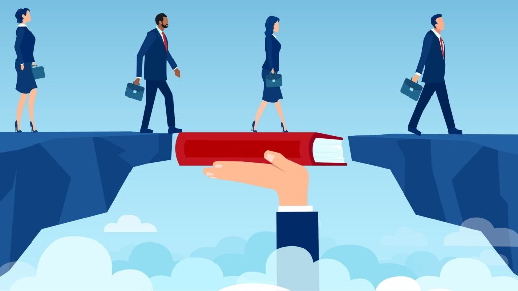 Le développement de la culture commerciale est un enjeu prioritaire pour notre pays - interview Harry Marteau - Co-fondateur et Directeur Commercial de Yuzu Corp Vecteur d’une main d’enseignant tenant un livre comblant le fossé dans l’éducation pour un groupe de personnes marchant sur